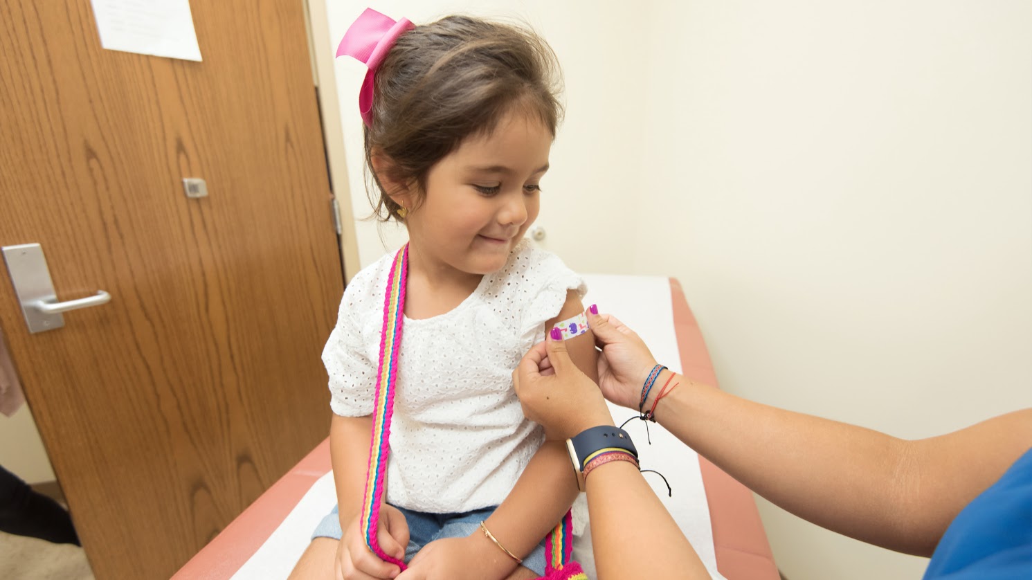 girl getting vaccine